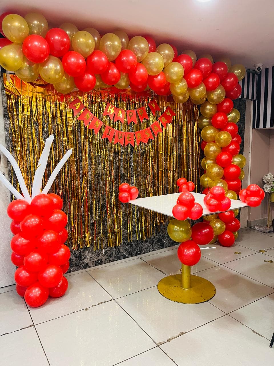 Anniversary balloon decoration with heart backdrop and lighting in Patna