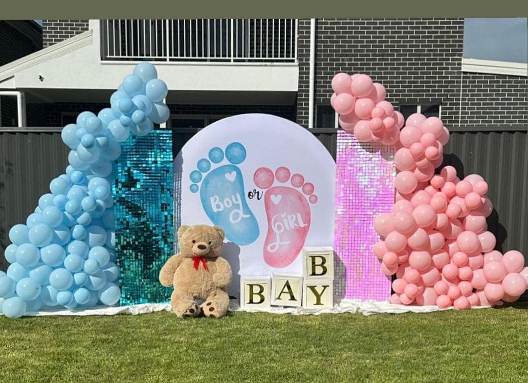 Baby shower balloon decoration with pastel arch and seating in Patna