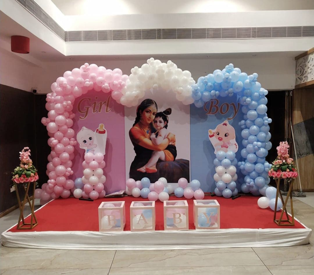 Baby shower balloon decoration with pastel arch and seating in Patna