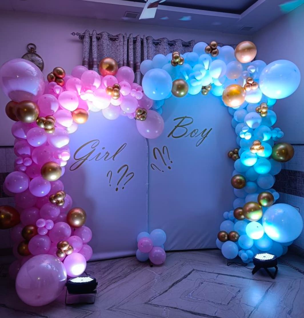 Baby shower balloon decoration with pastel arch and seating in Patna
