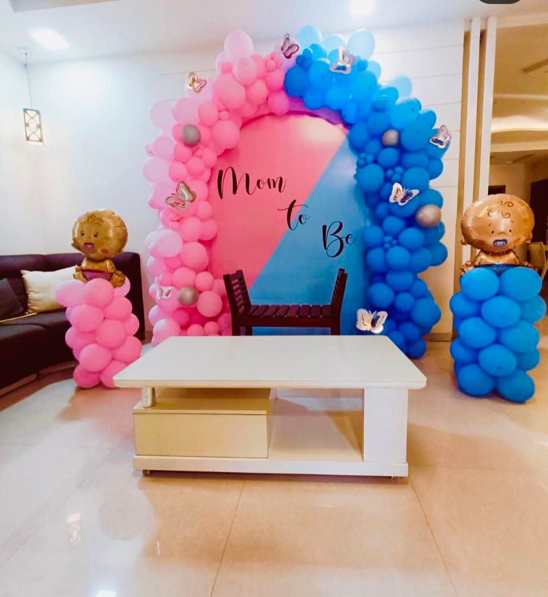 Baby shower balloon decoration with pastel arch and seating in Patna