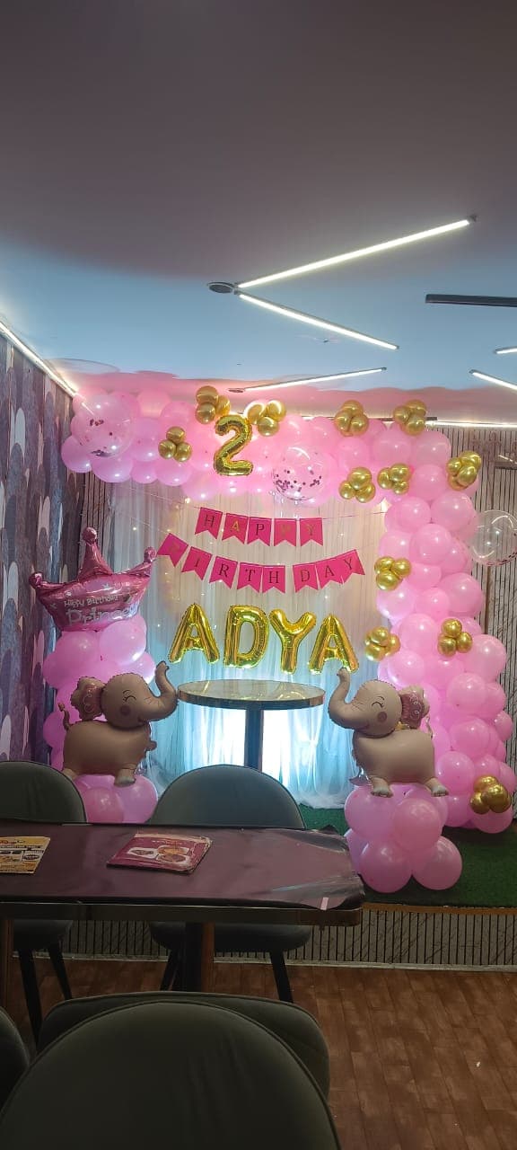 Birthday balloon decoration with backdrop and cake table in Patna